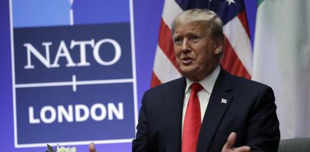 FILE - President Donald Trump meets with Italian Prime Minister Giuseppe Conte during the NATO summit at The Grove, Wednesday, Dec. 4, 2019, in Watford, England.  Former US president Donald Trump says he once warned that he would allow Russia to do whatever it wants to NATO member nations that are “delinquent” in devoting 2% of their gross domestic product to defense. Trump’s comment on Saturday represented the latest instance in which the former president and Republican front-runner seemed to side with an authoritarian state over America’s democratic allies. (AP Photo/ Evan Vucci, File)