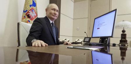 Russian President Vladimir Putin attends an electronic voting during a presidential voting at the Novo-Ogaryovo state residence outside Moscow, Russia, Friday, March 15, 2024. (Mikhail Metzel, Sputnik, Kremlin Pool Photo via AP)