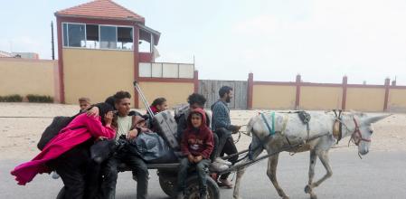 Palestinians fleeing north Gaza after Israeli troops raided Al Shifa hospital, move southward, amid the ongoing conflict between Israel and Hamas, in the central Gaza Strip March 18, 2024. REUTERS/Ramadan Abed