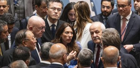 Russia's UN Ambassador Vassily Nebenzia, and China's U.N. Ambassador Zhang Jun, center left, speak with ambassadors of Arab countries before a Security Council meeting and vote on a resolution on Israel and Gaza conflict at UN Headquarters, Monday, March 25, 2024. At center is Malta's U.N. Ambassador Vanessa Frazier, and center right, Riyad Mansour, the Palestinian U.N. ambassador. (AP Photo/Craig Ruttle)