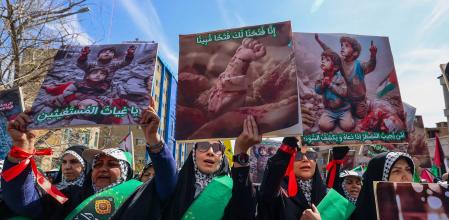 TOPSHOT - People attend the funeral procession for seven Islamic Revolutionary Guard Corps members killed in a strike in Syria, which Iran blamed on Israel, in Tehran on April 5, 2024. The Guards, including two generals, were killed in the air strike on April 1, which levelled the Iranian embassy's consular annex in Damascus. The funeral ceremony coincides with the annual Quds (Jerusalem) Day commemorations, when Iran and its allies stage marches in support of the Palestinians. (Photo by ATTA KENARE / AFP)