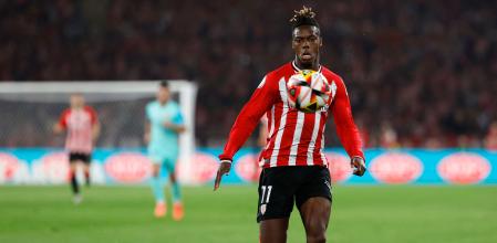 Athletic Bilbao's Spanish forward #11 Nico Williams runs for the ball during the Spanish Copa del Rey (King's Cup) final football match between Athletic Club Bilbao and RCD Mallorca at La Cartuja stadium in Seville on April 6, 2024. (Photo by Jaime REINA / AFP)