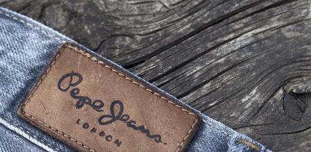 Gyar, Hungary - April 17, 2011: Pepe Jeans denim label on weathered table. Pepe Jeans brand was established in London in 1973.