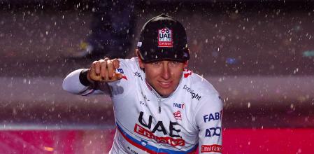 Team UAE's Slovenian rider Tadej Pogacar waves on stage during the opening ceremony and team presentation in Turin, on May 2, 2024, two days before the departure of the Giro d'Italia 2023 cycling race. The Giro d'Italia 2024 cycling race will depart from Venaria Reale near Turin on May 4, and finish in Rome on May 26. (Photo by Luca BETTINI / AFP)