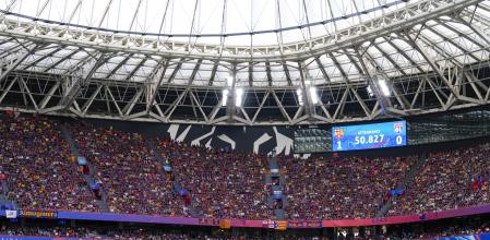 A screen displaying the attendance number of spectators during the women's Champions League final soccer match between FC Barcelona and Olympique Lyonnais at the San Mames stadium in Bilbao, Spain, Saturday, May 25, 2024. (AP Photo/Jose Breton)