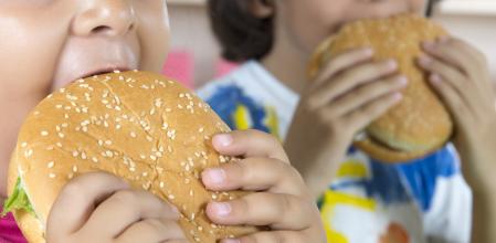 Boy And Girl With Hamburgers.  