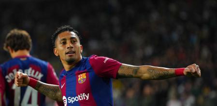 Barcelona's Brazilian forward #11 Raphinha celebrates after scoring his team's first goal during the Spanish league football match between FC Barcelona and UD Las Palmas at the Estadio Olimpic Luzcas Compañeros in Barcelona donde March 30, 2024. (Photo by Pau Barrena / AFP)