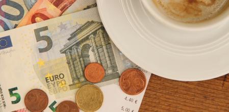 an invoice with an empty coffee cup