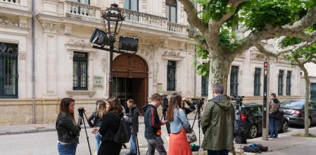 Journalists wait in front of the Archbishopric of Burgos, where the Poor Clare Sisters of Belorado were expected to be heard, in Burgos in northern Spain, on June 21, 2024. A community of nuns in a 15th century convent in northern Spain has split with the Roman Catholic Church because of a property dispute and doctrinal wrangling that has seen them join up with a renegade priest. (Photo by CESAR MANSO / AFP)