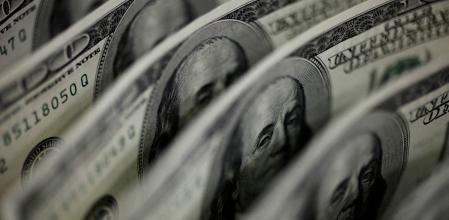 FILE PHOTO: A picture illustration shows U.S. 100 dollar bank notes taken in Tokyo August 2, 2011. REUTERS/Yuriko Nakao/File Photo/File Photo