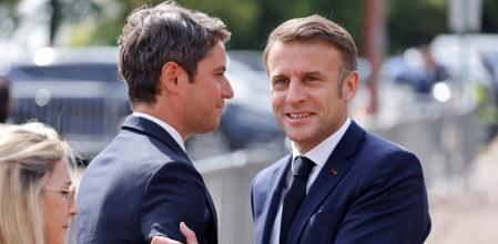 French President Emmanuel Macron shakes hands with France's Prime Minister Gabriel Attal during a ceremony marking the 84th anniversary of late French General Charles de Gaulle's World War II resistance call of June 18, 1940, at the Mont-Valerien memorial in Suresnes, France June 18, 2024.     LUDOVIC MARIN/Pool via REUTERS