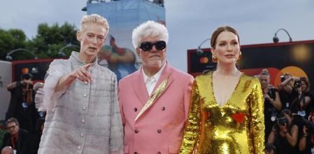 Tilda Swinton, from left, director Pedro Almodovar, and Julianne Moore pose for photographers upon arrival for the premiere of the film 'The Room Next Door' during the 81st edition of the Venice Film Festival in Venice, Italy, on Monday, Sept. 2, 2024. (Photo by Joel C Ryan/Invision/AP)