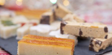 Yolks Turron and polvorones from  Spanish Christma table. Marzipan turron with candied fruits.