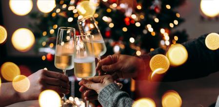 New year and Christmas celebration with champagne in front the Christmas tree.