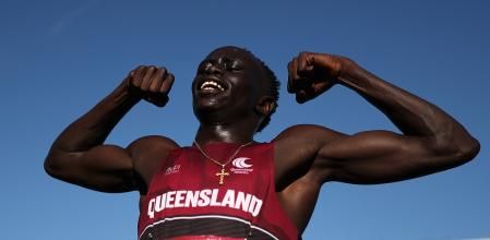 BRISBANE, AUSTRALIA - DECEMBER 07: Gout Gout of Queensland celebrates winning the Boys' U18 200m Final in a new national time of 20.04 seconds during the 2024 Chemist Warehouse Australian All Schools Athletics Championship at Queensland Sport and Athletics Centre on December 07, 2024 in Brisbane, Australia. (Photo by Cameron Spencer/Getty Images)