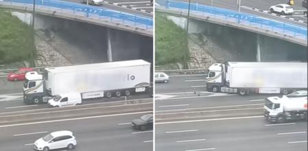 La temeraria maniobra que realiza el conductor de un camión en una autovía de Madrid: 