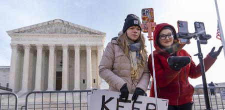 Sarah Baus, left, of Charleston, S.C., and Tiffany Cianci, who says she is a 