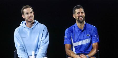 TOPSHOT - Britain#{emoji}146;s Andy Murray (L) reacts with Serbia#{emoji}146;s Novak Djokovic during a charity event titled #{emoji}145;Night with Novak#{emoji}146; on Rod Laver Arena in Melbourne on January 9, 2025 ahead of the Australian Open tennis championship starting on January 12. (Photo by DAVID GRAY / AFP) / -- IMAGE RESTRICTED TO EDITORIAL USE - STRICTLY NO COMMERCIAL USE --