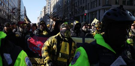 Members of the far-right Proud Boys and police officers, on the inauguration day of Donald Trump's second presidential term in Washington, U.S. January 20, 2025. REUTERS/Marko Djurica
