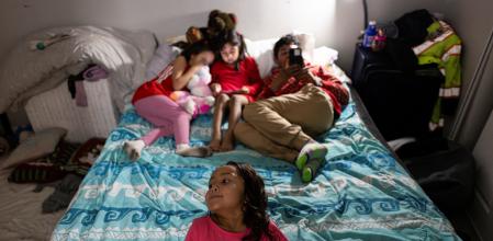 A Venezuelan family gets ready for bed in their apartment amid a time when, despite having legal documentation to reside in the U.S., they fear reports that U.S. Immigration and Customs Enforcement agents may come to detain immigrants for deportation, in Aurora, Colorado, U.S., January 30, 2025. REUTERS/Kevin Mohatt