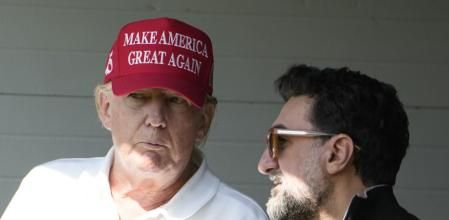 FILE - Former President Donald Trump talks with Yasir Al-Rumayyan, during the first round of the LIV Golf Tournament at Trump National Golf Club, in Sterling, Va., May 26, 2023. (AP Photo/Alex Brandon, File)