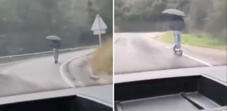 El surrealista comportamiento de un conductor de patinete en Arbúcies con una tormenta y llevando un paraguas: “Lo tiene todo para ser invisible”