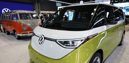 The 2025 Volkswagen ID Buzz Microbus, an electric minivan, is displayed during the press preview of the New York International Auto Show at the Jacob Javits Convention Center in New York City on April 16, 2025. Tariff talk dominated the Automotive Forum on April 15, held just ahead of the annual New York International Auto Show. US President Donald Trump's aggressive but fast-changing trade policy has foisted difficult questions on carmakers that they have not yet been forced to answer. While Trump has retreated from some of his most onerous tariffs, carmakers are on the hook for 25 percent levies on auto imports that went into effect on April 3. (Photo by TIMOTHY A. CLARY / AFP)