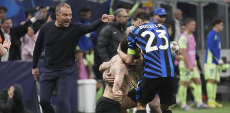 Inter Milan players celebrate in fron ot Barcelona's head coach Hansi Flick during the Champions League semifinal second leg soccer match between Inter Milan and Barcelona at San Siro stadium in Milan , Italy, Tuesday, May 6, 2025. (AP Photo/Antonio Calanni)