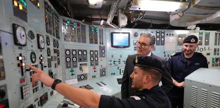 OSLO, NORWAY - MAY 9: Britain's Prime Minister Keir Starmer listens to Royal Marines on the HMS ST Albans in Oslo, during his visit to Norway on May 9, 2025 in Oslo, Norway. The Prime Minister is attending the Joint Expeditionary Force (JEF) Leaders' Summit alongside other hears of state from the ten-member coalition, which will focus on strengthening security throughout the region. (Photo by Alastair Grant - WPA Pool/Getty Images)