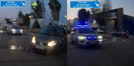 El momento en el que un coche sale de una rotonda desde el carril interior, los Mossos d'Esquadra le pillan de pleno y salen detrás del conductor para sancionarle