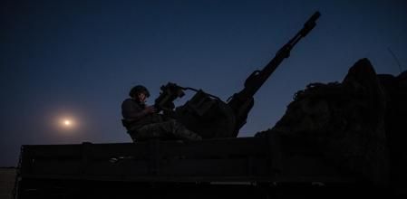 Undisclosed location (Ukraine), 09/07/2025.- Two soldiers from a Ukrainian Army anti-aircraft artillery brigade scan their sector for Shahed drones on Ukraine's southern frontline on the night Russia launched the largest combined airstrike since it began its full-scale invasion of Ukraine, 08 July 2025. The unit operates a truck-mounted ZU-23-2 air defence system with a twin 23-calibre gun capable of targeting objects flying below 2,500 metres. (Rusia, Ucrania) EFE/EPA/Maria Senovilla