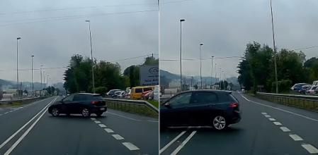 El momento en el que un coche hace un cambio de sentido prohibido, saltándose una doble línea continua tras una incorporación