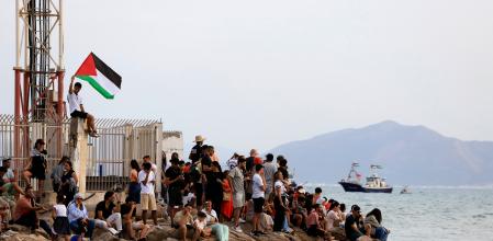Tunisian people chant in support of the the Global Sumud Flotilla as it arrives at the port of Sidi Bou Saïd, in Tunis, Tunisia, Sunday, Sept. 7, 2025. (AP Photo/Anis Mili)
