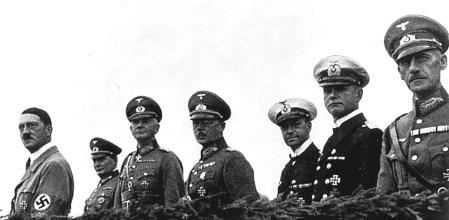 (GERMANY OUT) Germany, Third Reich - Nuremberg Rally 1935 From the left: Adolf Hitler, Hermann Goering, Reich Minister of Defense General Werner von Blomberg, the commander-in-chief of the Army High Command Baron Werner von Fritsch, and Admiral Erich Raeder watching 'Wehrmacht' (the Defense Force) exercises on the rally ground| (Photo by Heinz Dorn/ullstein bild via Getty Images)