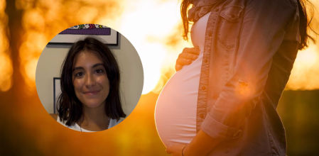 Mujer embarazada con una puesta de sol