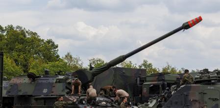 MUNSTER, GERMANY - MAY 10: Mechanic soldiers of the Bundeswehr, the German armed forces are seen as they service a Panzerhaubitze 200 - the Pzh 2000 self-propelled howitzer in the Wettiner Heide (Wettiner Meadow) international joint military exercises of NATO Response Force (Land) on May 10, 2022 near Munster, Germany. The forces include the Panzergrenadierbrigade 37 (Armoured Infantry Brigade 37), which currently leads the NATO Very High Readiness Joint Task Force (VJTF). The current exercises, which run from May 2-20, include armoured and artillery units with 7,500 soldiers from nine different nations, though mainly from Germany and the Netherlands. (Photo by Morris MacMatzen/Getty Images)