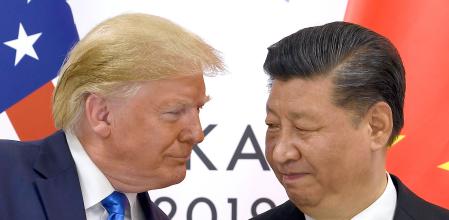 FILE - U.S. President Donald Trump, left, meets with Chinese President Xi Jinping during a meeting on the sidelines of the G-20 summit in Osaka, Japan, June 29, 2019. (AP Photo/Susan Walsh, File)