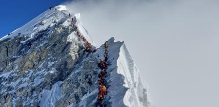 Mountaineers form a queue as they approach the summit of Mount Everest in Nepal, May 18, 2025. (AP Photo/Kunga Sherpa, File)