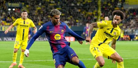 VILLARREAL, SPAIN - DECEMBER 21: Lamine Yamal of FC Barcelona is challenged by Tajon Buchanan of Villarreal CF during the LaLiga EA Sports match between Villarreal CF and FC Barcelona at Estadio de la Ceramica on December 21, 2025 in Villarreal, Spain. (Photo by Alex Caparros/Getty Images)