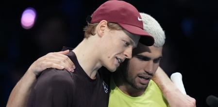 Italy's Jannik Sinner, left, and Spain's Carlos Alcaraz hug after the final tennis match of the ATP World Tour Finals, in Turin, Italy, Sunday, Nov. 16, 2025. (AP Photo/Antonio Calanni)