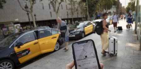 Taxis y aplicación de Uber-guerrra de taxis