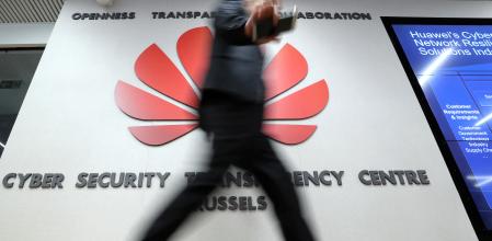 FILE PHOTO: A man visits the Huawei Cyber Security Transparency Centre in Brussels, Belgium March 5, 2019. REUTERS/Yves Herman/File Photo