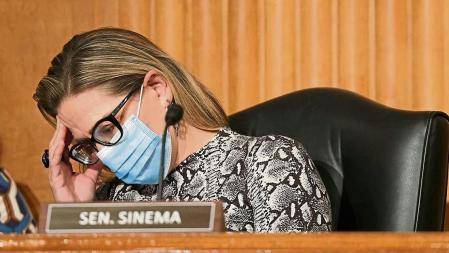 WASHINGTON, DC - OCTOBER 06: Sen. Kyrsten Sinema (D-AZ) attends a Senate Homeland Security and Governmental Affairs Committee meeting to discuss committee matters on Capitol Hill on October 06, 2021 in Washington, DC. The committee met to discuss topics including amendments to the Inspector General Act of 1978 and the Homeland Security Act of 2002 and to vote on several nominations to security posts. Kevin Dietsch/Getty Images/AFP == FOR NEWSPAPERS, INTERNET, TELCOS & TELEVISION USE ONLY ==