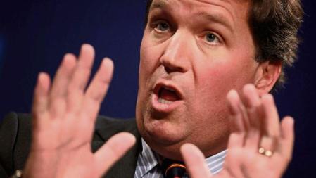 (FILES) In this file photo taken on March 29, 2019 Fox News host Tucker Carlson discusses 'Populism and the Right' during the National Review Institute's Ideas Summit at the Mandarin Oriental Hotel in Washington, DC. - In the world of Tucker Carlson's hit TV show, America is under assault -- by Democrats, by health authorities, by immigrants, by Black Lives Matter protests -- and white conservatives are in a fight for their very survival. Anti-white racism is on the rise. Modern liberals hate Christianity. Migrants are invading. These are just a few of the claims made by the host of 