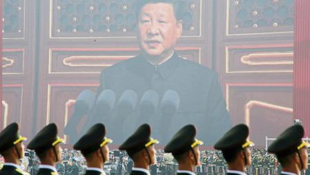 FILE PHOTO: Soldiers of People's Liberation Army (PLA) are seen before a giant screen as Chinese President Xi Jinping speaks at the military parade marking the 70th founding anniversary of People's Republic of China, on its National Day in Beijing, China October 1, 2019. REUTERS/Jason Lee/File Photo To match Special Report TAIWAN-CHINA/SUBMARINES