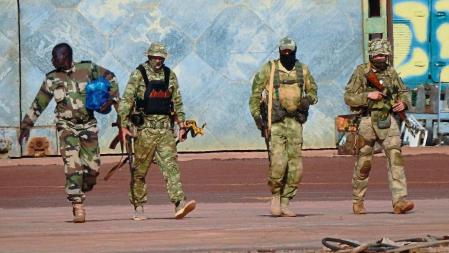 FILE - This undated file photograph issued by French military shows three Russian mercenaries, right, in northern Mali. Russia has engaged in under-the-radar military operations in at least half a dozen countries in Africa in the last five years using a shadowy mercenary force analysts say is loyal to President Vladimir Putin. Russia’s invasion of Ukraine is certain to dominate an upcoming NATO summit in Madrid. But host nation Spain and other members are quietly pushing the Western alliance to consider how mercenaries aligned with Russian President Vladimir Putin are spreading Moscow’s influence in Africa. (French Army via AP, File)