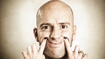 Woman making a bored man smile.