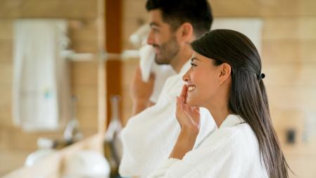 Portrait of a loving couple in the bathroom following their morning routine and looking very happy - lifestyle concepts
