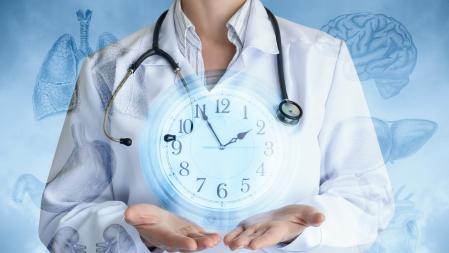 Doctor shows the clock on the background of internal organs and the sky.