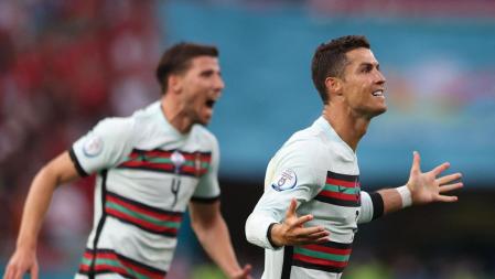 Portugal's forward Cristiano Ronaldo celebrates scoring his team's third goal during the UEFA EURO 2020 Group F football match between Hungary and Portugal at the Puskas Arena in Budapest on June 15, 2021. (Photo by Alex Pantling / POOL / AFP)
